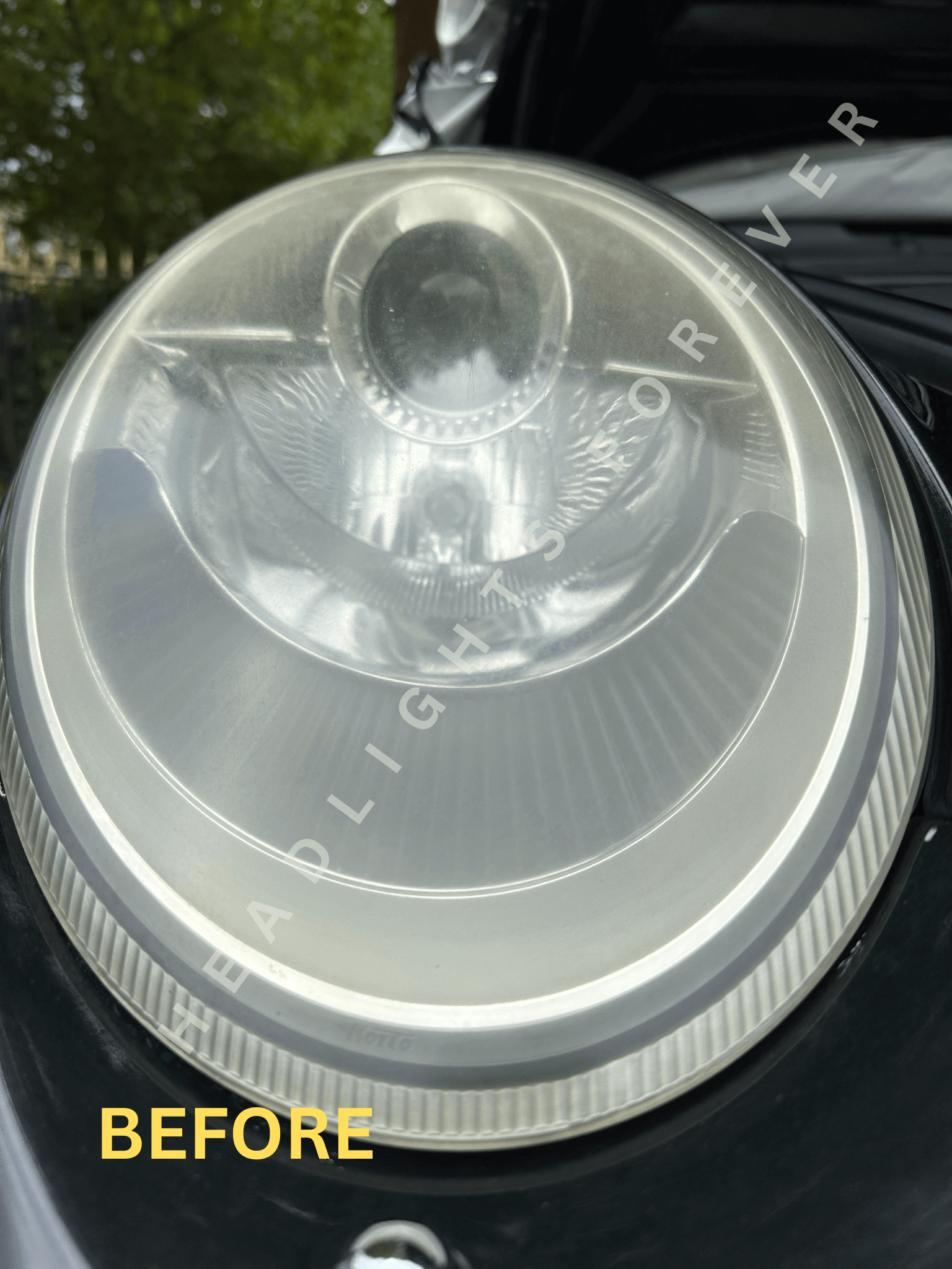 Porsche 911 headlight before restoration